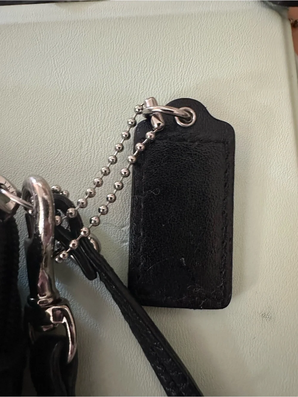 COACH Black Pebbled Leather Double Zipper Wristlet, Logo Disc, Ice Blue Lining